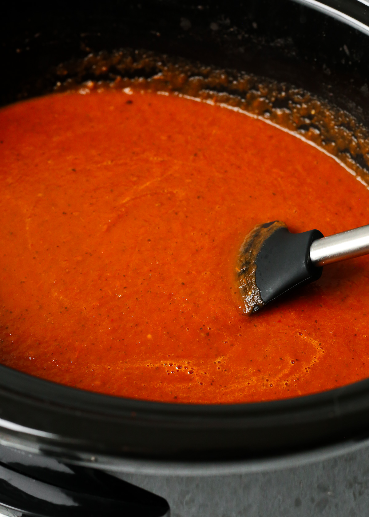 The blended marinara sauce in the slow cooker, appearing thick and smooth with a rich red color.