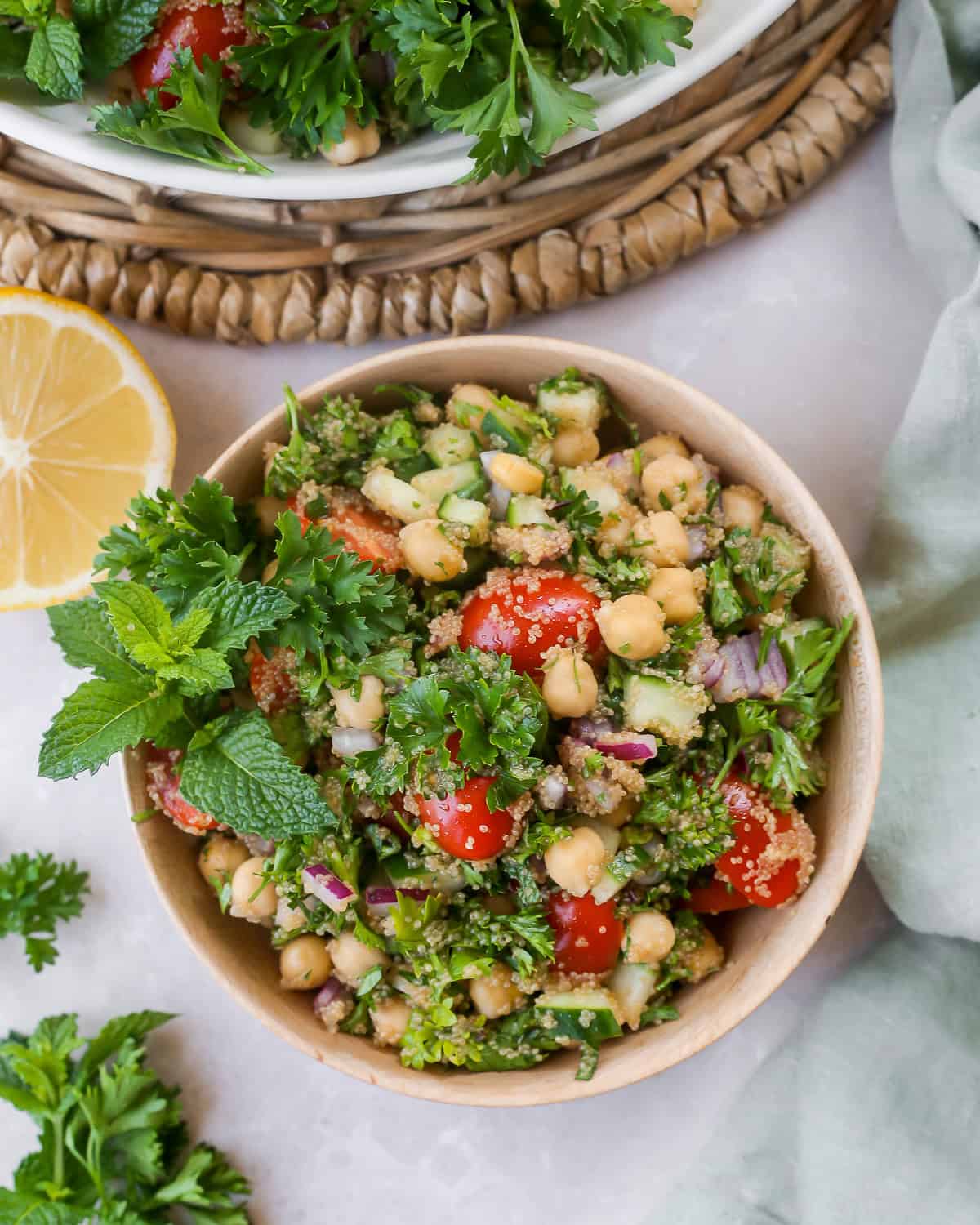 Overhead view of amaranth tabbouleh, served in a wooden salad bowl. 