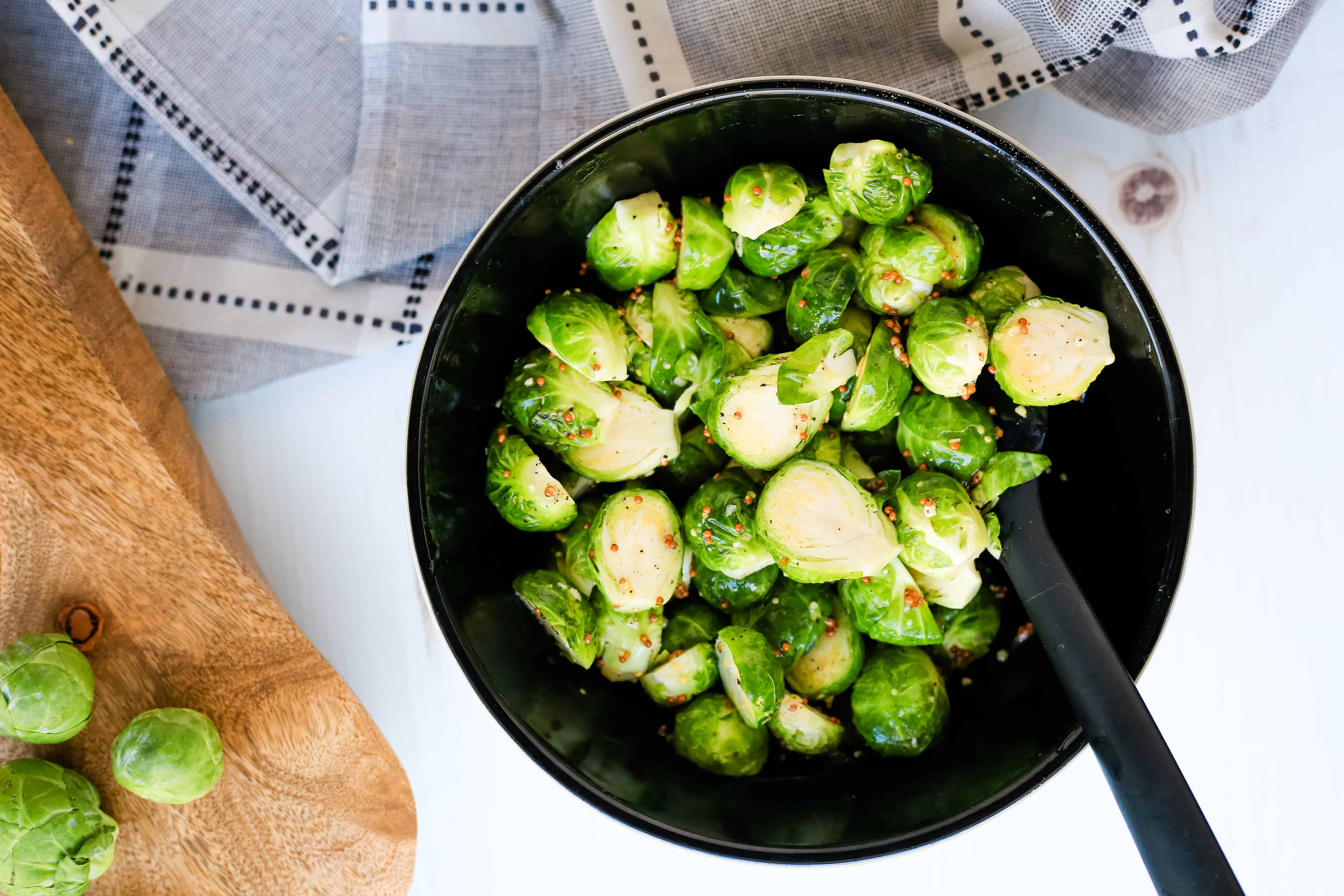 Maple Mustard Brussels Sprouts with Creamy Dijon Aioli | Honey mustard, move aside. You'll love these roasted Maple Mustard Brussels Sprouts with a Creamy Dijon Aioli. It's the perfect holiday side dish!