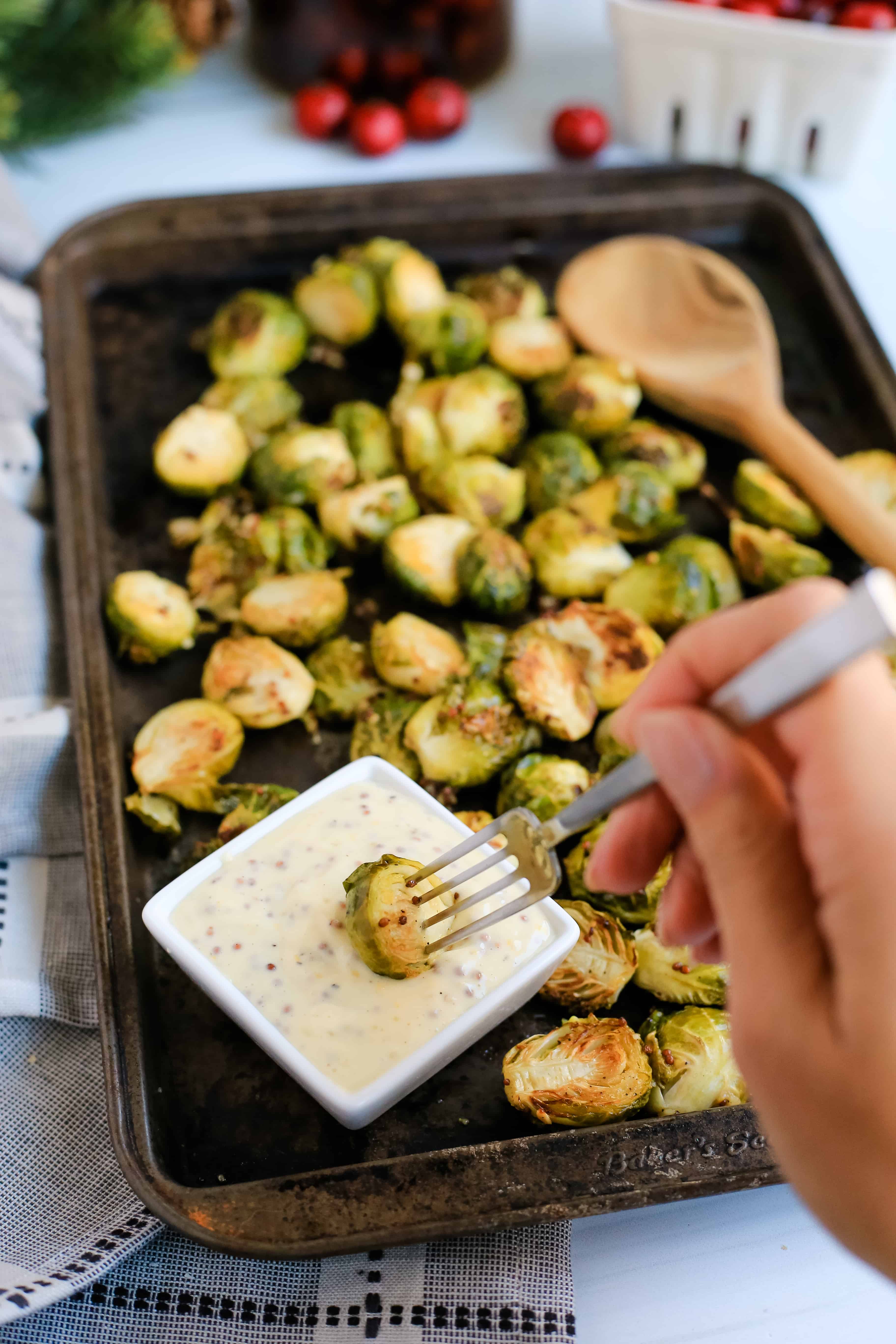 Maple Mustard Brussels Sprouts with Creamy Dijon Aioli | Honey mustard, move aside. You'll love these roasted Maple Mustard Brussels Sprouts with a Creamy Dijon Aioli. It's the perfect holiday side dish!