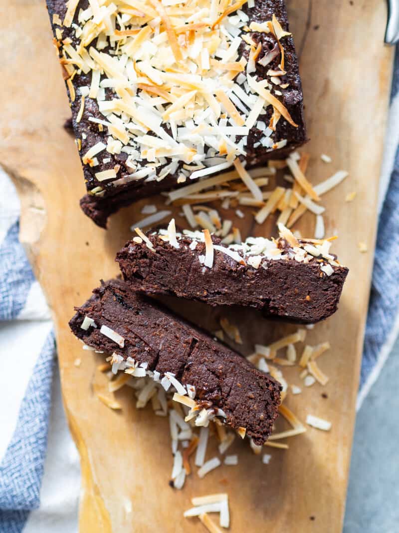 Flourless Sticky Chocolate Plum Cake with prune puree on a cutting board