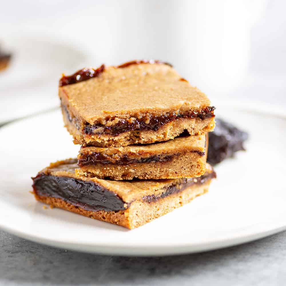 Stack of prune bars on a white plate