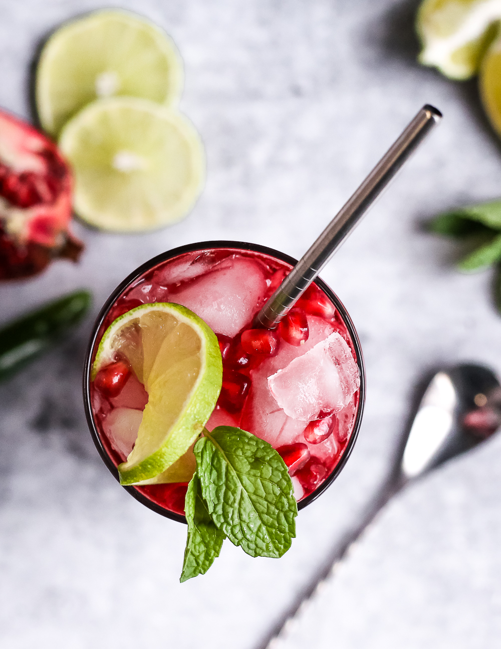 Overhead view of a Spicy Pomegranate Mojito Mocktail, and non-alcoholic pomegranate cocktail