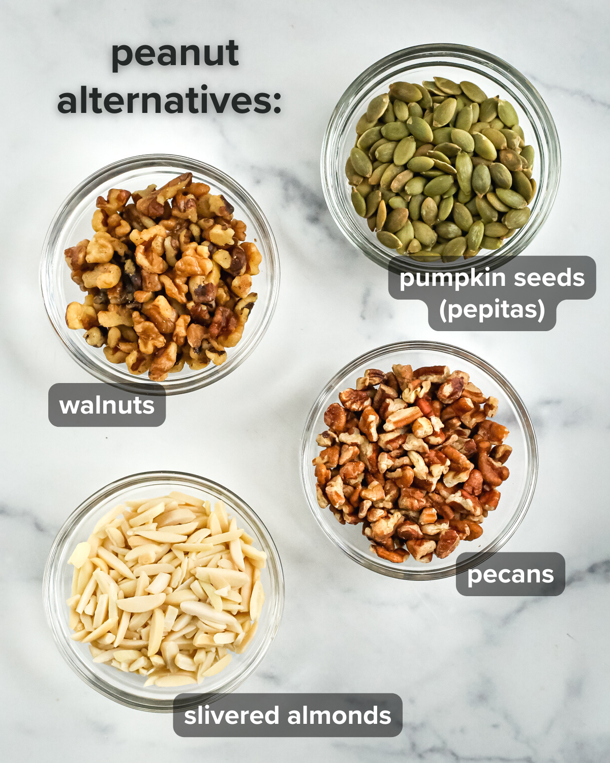 An infographic showing some peanut-free alternatives for date bark, all displayed in small clear glass ramekins. Each is labeled with lowercase white text on a black background, and clockwise is displayed pumpkin seeds, pecans, slivered almonds, and walnuts