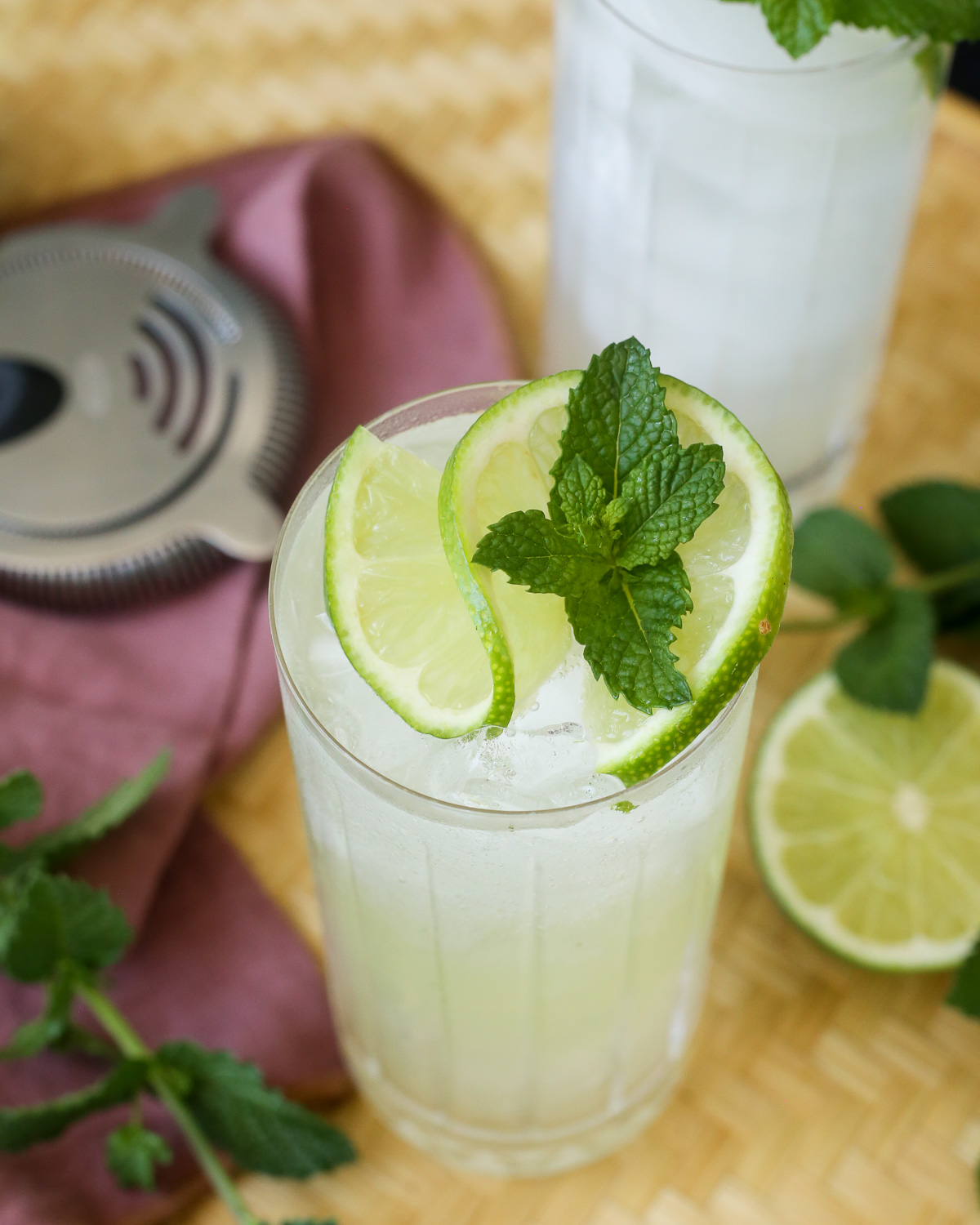 A close view of the lime and mint garnish on a yuzu mojito. 