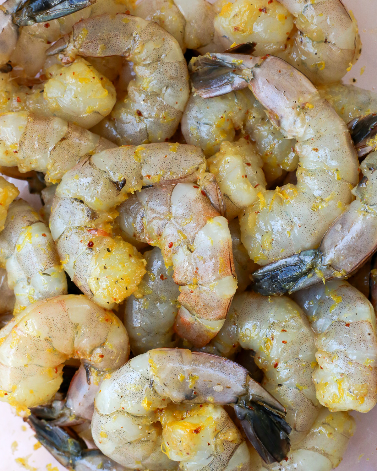 Raw shrimp tossed with olive oil, lemon zest, red pepper flakes, and salt. 